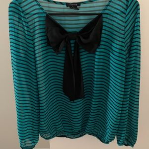 Turquoise top with long sleeves and black bow